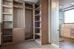 Organized walk-in closet with various storage solutions