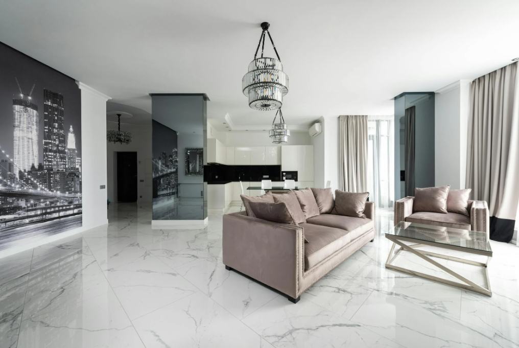 Apartment interior with white marble floors and modern furniture.