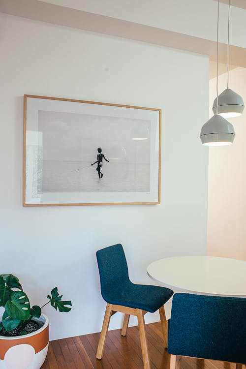 An image of the interior of a room with chairs and a table