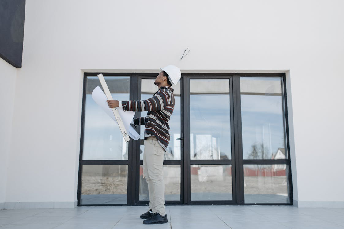 An image of a man checking a house
