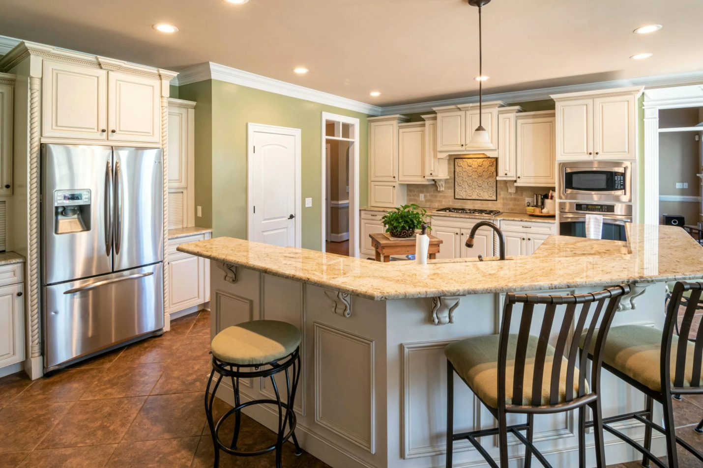A kitchen with a light-colored granite countertop