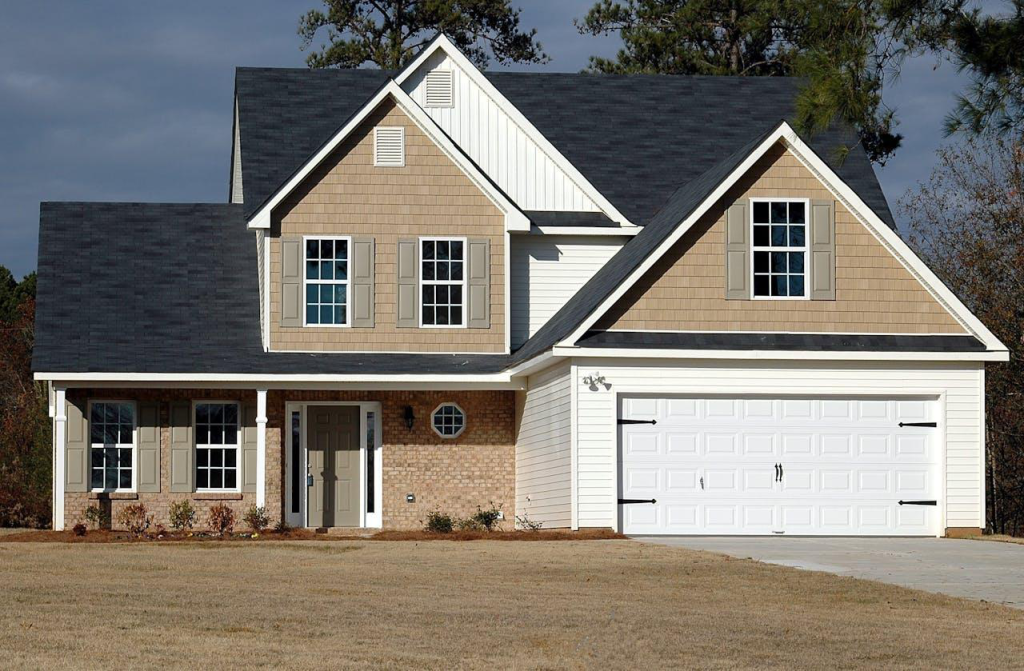 Blue colored roof with white and beige house