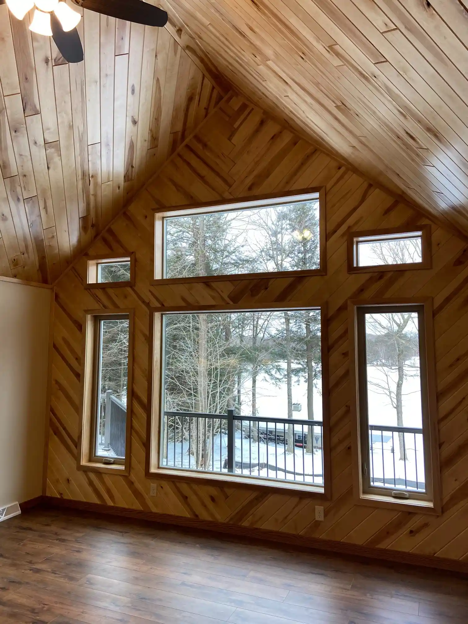 An image of a window in a Rhinelander home overlooking snow