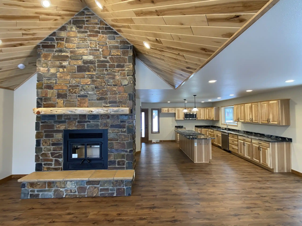 A living room with connected kitchen.